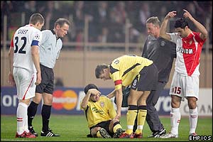 Liverpool's Luis Garcia lies injured 