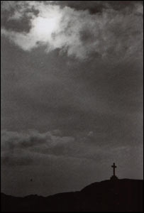 The afternoon sky over ynys Llanddwyn. The cross is a memorial for Dwynwen, the patron saint of Welsh lovers (Huw Williams, Manchester)