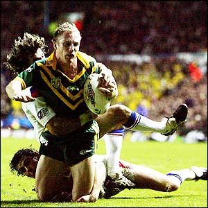 GB try to stop Lockyer but he adds another try to the Australian's tally