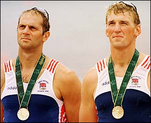 Steve Redgrave and Matthew Pinsent collect their gold medals at the Atlanta Olympic games