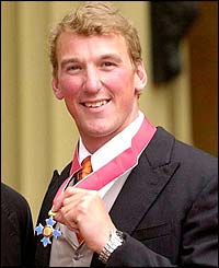 Pinsent proudly displays his CBE at Buckingham Palace