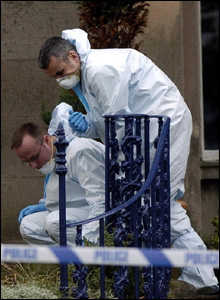 Forensics officers on the steps of the Mr Wilson's house