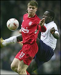 Liverpool's Neil Mellor battles for the ball with Thimothee Atouba 