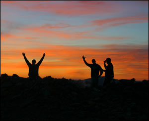 Zac, John and David at the top of Moel Siabod at sunset, as captured by Rob Ansell