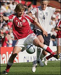 Anne Dot Eggers Nielsen challenges England's Katie Chapman