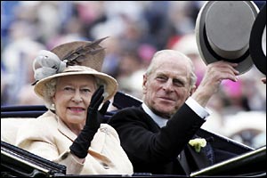 The Queen and Duke of Edinburgh wave to the crowds