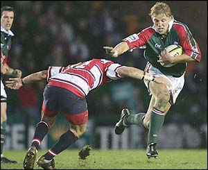 Leicester's Lewis Moody is tackled by Henry Paul of Gloucester