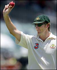 Australia's Glenn McGrath holds the match ball aloft