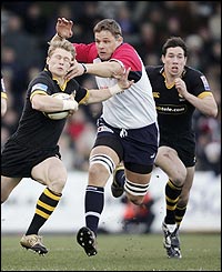 Wasps' Josh Lewsey is grabbed by Bristol's Ed Pearce