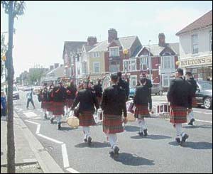 Members of the Welsh Piping Society marching in the midday heat during the Grangetown Festival in Cardiff (sender not supplied)
