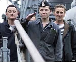 The mini-sub's commander salutes as he comes ashore in Petropavlovsk-Kamchatsky