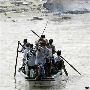 People cross by boat in Nagappattinam port