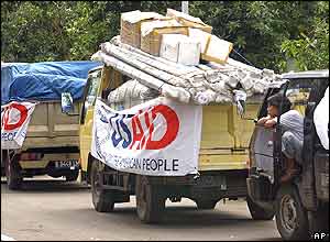Drivers with trucks loaded with aid packages bound for Banda Aceh wait in a queue, Saturday, Jan. 1, 2005, at Halim Air Force Base in Jakarta, Indonesia. 