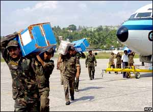 Indian army soldiers carry relief materials in the capital of Andaman and Nicobar Islands, Port Blair.