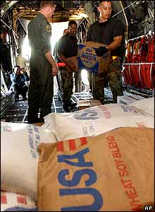 US Air Force soldiers load food water onto an aid flight bound for Banda Aceh, in Jakarta, Indonesia.