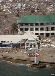 An Indonesian flag flies at half-mast from a government building in Meulaboh, 2 Jan