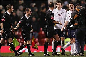 Tottenham's Michael Carrick and Robbie Keabe remonstrate with officials