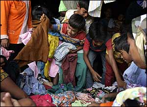 Refugees receive clothes in centre on the edge of Banda Aceh