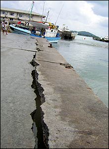 Boats lie stranded on damaged harbour in Seychelles