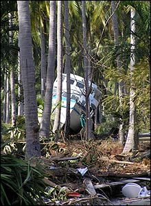 Boat smashed inland by water in Koh Phi Phi island in Thailand