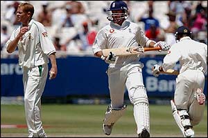Pollock watches as Jones and Giles add another run