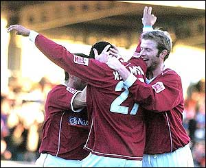 Lee Williamson celebrates as he equalises for Northampton from 25 yards out