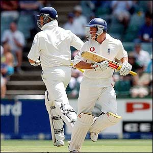 England's Andrew Strauss and Marcus Trescothick run between the wickets