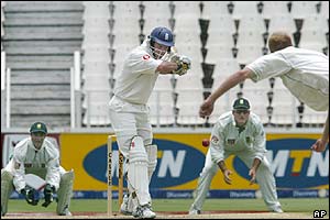 Andrew Strauss plays a drive off the bowling of Shaun Pollock