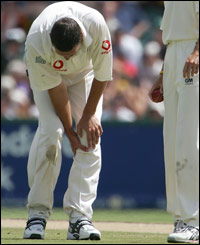 Steve Harmison pulls up as he pulls his calf muscle