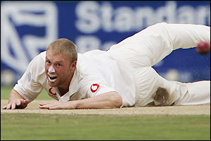Andrew Flintoff sees a shot race past him on his way to figures of 1-77 off 30.1 overs