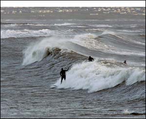 Huge waves at Trecco Bay, Porthcawl with Ogmore in the background (Nick Russill)