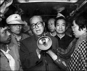 Zhao Ziyang (centre) addresses the student hunger strikers through a megaphone, 19 May 1989, in a bus in Tiananmen Square in Beijing. To his right is current Premier Wen Jiabao.