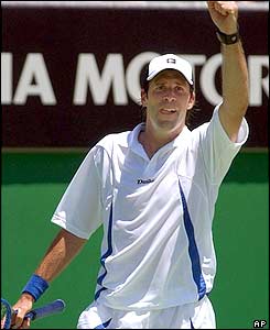 Greg Rusedski salutes the crowd as he pulls off an unlikely victory