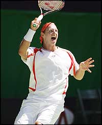 David Nalbandian gets through to the second round in five sets