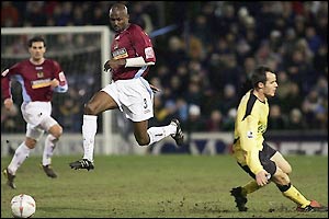 Guinean defender Mo Camara passes David Raven as Burnley attack