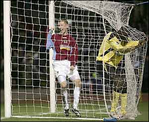 Djimi Traore ends up in the net as he scores an own goal that puts Liverpool the backfoot
