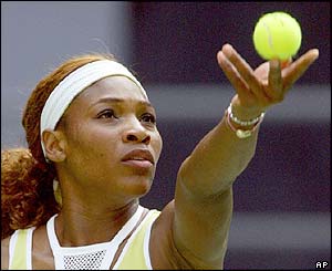 Serena Williams serves the ball