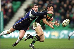 Leeds' Tim Stimpson tackles Northampton's Marc Stcherbina