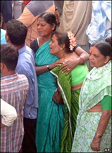 Women openly mourn the victims of the stampede