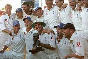 England celebrate with the Basil D'Oliveira Trophy