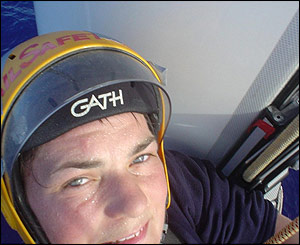Concentration is etched on Ellen's face as she shimmies up the mast to patch up the damage