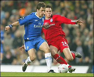 Joe Cole of Chelsea and Darren Carter of Birmingham City compete for the ball