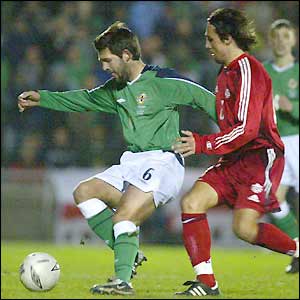 Tommy Doherty tries to find a way through for Northern Ireland