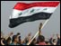 Iraqis wave Iraqi flag