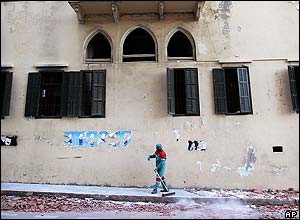Street cleaner sweeping up the pavement
