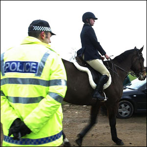 Police officer monitors a hunt