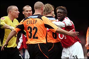 Arsenal's Kolo Toure clashes with Danny Cullip