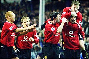 Cristiano Ronaldo is mobbed after his goal seals the win for Man Utd at Goodison