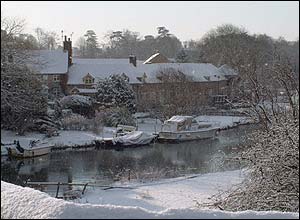 River and houses covered in snow