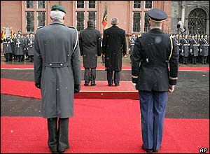 US President George Bush (centre right) and German Chancellor Gerhard Schroeder (centre left) listen to their national anthems in Mainz, Germany